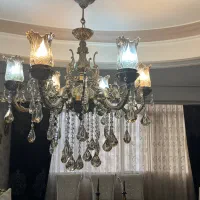 یک عدد شمعدان و یک عدد لوستر برنز در حد نو