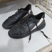 کفش نو|کیف، کفش، کمربند|تربت جام, میان جام|دیوار