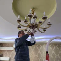 برقکار ساختمان با انصاف - نصاب لوستر حرفه ای