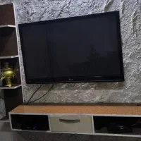 تلویزیون میزوبغل دیواری