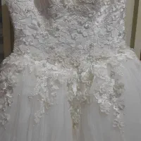 کرایه لباس عروس و تل کریستالی دسته گل عروس