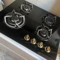 گاز رو میزی چهار شعله با کابینت نو نو استفاده نشده