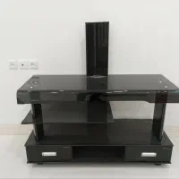 میز شیشه ای تلویزیون