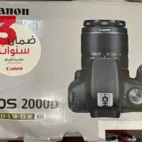 دوربین کنونD2000 در حد نو با پایه و رم64