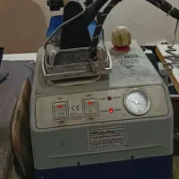 اتو بخار مخزن دار و میز مکش سیلتر