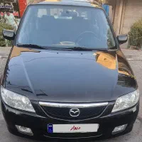 مزدا ۳۲۳ مشکی اتومات مدل ۸۵ تیپ ۵ استثنایی|خودرو سواری و وانت|تهران, تهران‌نو|دیوار