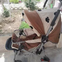 کالسکه کرم قهوه یی