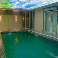 استخر آبگرم با عمارتی دل باز|اجارهٔ کوتاه‌مدت ویلا و باغ|رشت, بلوار گیلان|دیوار