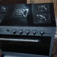 یک دستگاه لباسشویی و یخچال و اجاق گاز