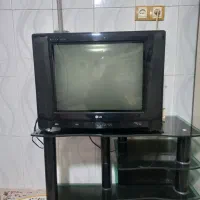 تلویزیون LG  با میز  شیشه ایی