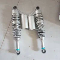 کمک عقب موتور سیکلت