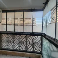 درب و پنجره و بالکن شیشه ای