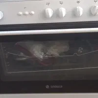اجاق گاز فر دار و جوجه گردان اسنوا