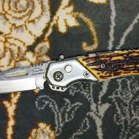 چاقو زامن دار دسته طرح شاخ تاشو