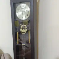 ساعت ایستاده و میز  تلفن