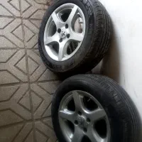 ۴ حلقه رینگ و لاستیک ۵ پر سایز ۱۵ لاستیک ۶۰ درصد|قطعات یدکی و لوازم جانبی|مشهد, سرافرازان|دیوار