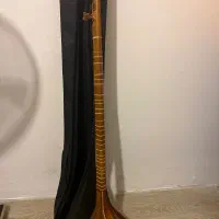 سه تار بهمراه چندکتاب آموزشی|سازهای سنتی|نور, |دیوار