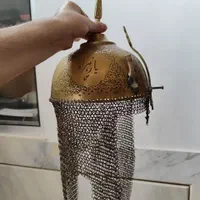 کلاه خود تمام برنجی و قلمکاری شده