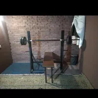 دستگاه پرس سینه با هالتر و وزنه