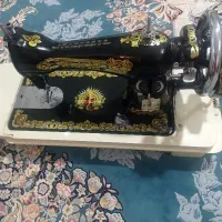 چرخ خیاطی مرد پرنده