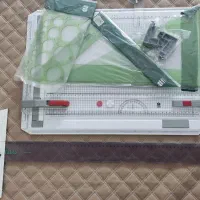 تخته رسم مهندسی به همراه خط کش و گونیا و شابلون