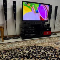 میز تلوزیون برند ترک هستش وDVD ال جی