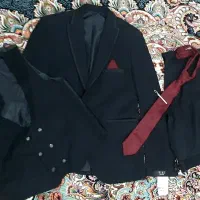 کت و شلوار مردانه|لباس|رباط‌کریم, رباط‌کریم|دیوار