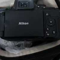 نیکون Nikon D5100 در حد نو + لنز + باتری اضافه|دوربین عکاسی و فیلم‌برداری|شیراز, شاهچراغ|دیوار