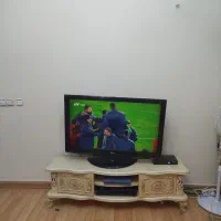 تلویزیون ال سی دی 42 اینچ مدل ال جی همراه میز