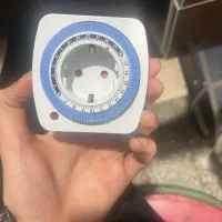 دوشاخه تایمری سفید روغنی