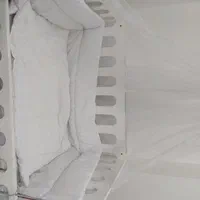 تخت و گهواره نوزاد کنار مادر