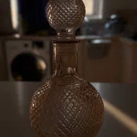 تنگ شیشه‌ای در دار