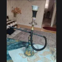 گوشی،منبع اگزوز ماشین،مانتو و شلوار،قلیان برنجی
