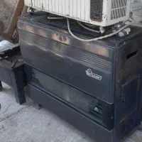 یک بخاری برقی قدیمی سالم یک بخاری گازی