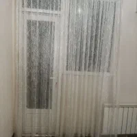 پرده تور شیری رنگ چین دار