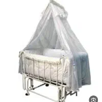 تخت گهواری کنار مادر