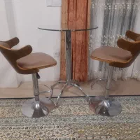 میز گرد شیشه‌ای پایه استیل