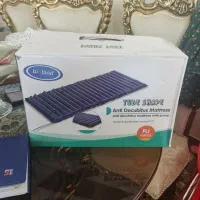 تشک مواج سلولی اکبند به همراه یک ویلچر تایوانی