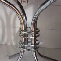 میز  شیشه ای گرد با  پایه استیل با چهار صندلی