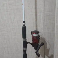 چوب ماهیگیری و کیسه خواب