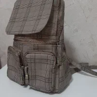 کوله چرمی . توت بگ . کلاه . استند
