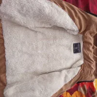 کاپشن|کفش و لباس بچه|قم, قلعه کامکار|دیوار