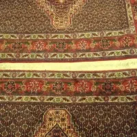 قالیچه  بافته شده به هم