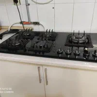 یه عدد گاز رو میزی کم کار در حد نو همراه با کمد