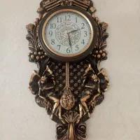 ساعت دیواری آونگ دار