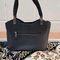 کیف|کیف، کفش، کمربند|قم, وادی السلام|دیوار