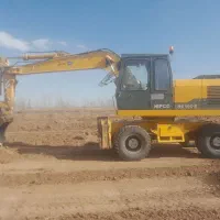 بیل مکانیکی لاستیکی خشک