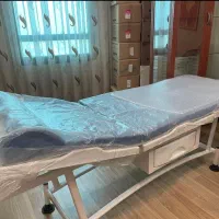 تخت معاینه همراه با پایه سرُم