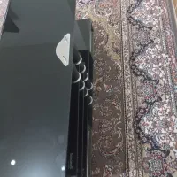 زیر تلویزیون شیشه ای