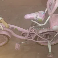 دوچرخه دخترانه به همراه چرخ کمک و ...